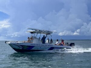 Sleek boat cruising the azure waters of the ocean, representing the best multi-activity boat tours in Islamorada, FL