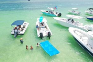 Aerial drone shot of the 2015 Twin Vee 26-Foot Ocean Cat from Lightly Salted Charters on the Islamorada Sandbar in Florida.